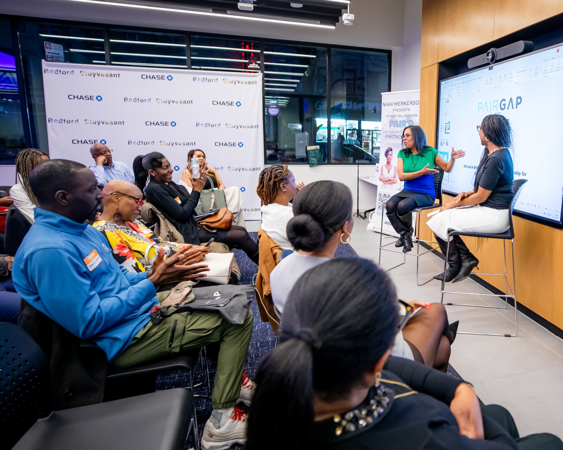 Real estate agent speaking to attendees at a Pairgap Spaces event